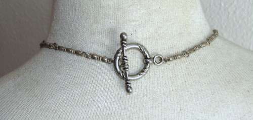 Vintage silver tone heart pendant necklace with clear and purple faceted crystal