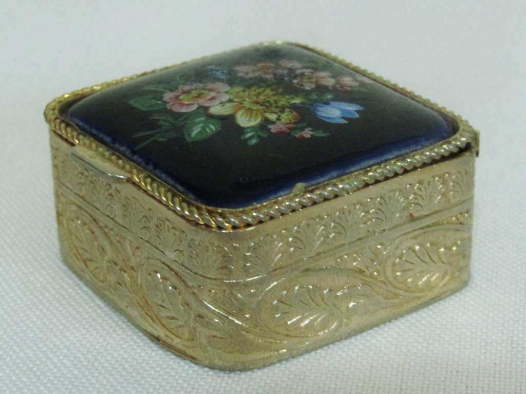 Small square gold tone pill box with cobalt blue floral bouquet ceramic decoration