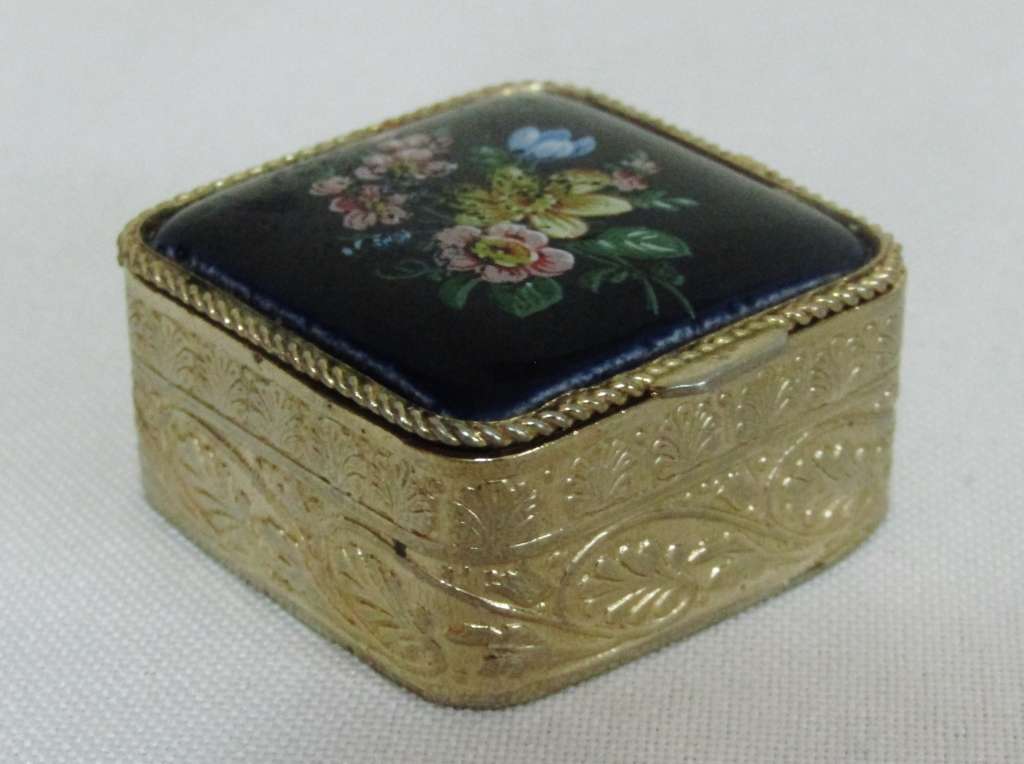 Small square gold tone pill box with cobalt blue floral bouquet ceramic decoration