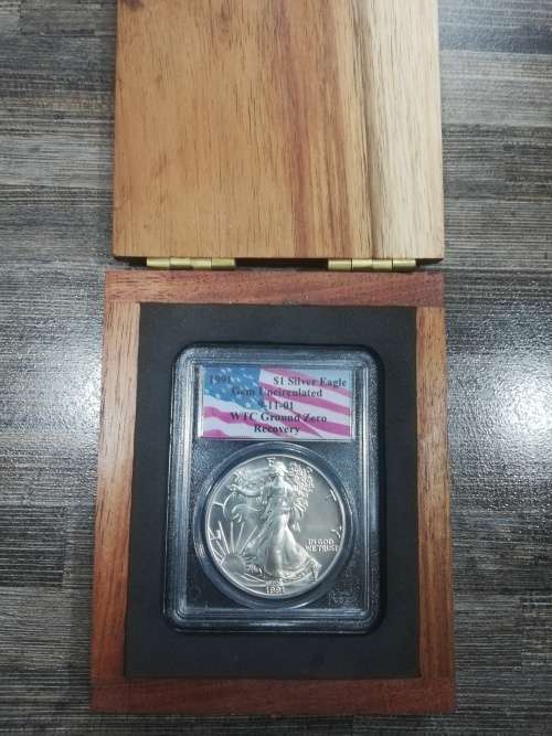 THIS COIN WAS RECOVERED FROM UNDER THE RUBBLE IN THE WORLD TRADE CENTRE AFTER THE 9-11 ATTACKS.
