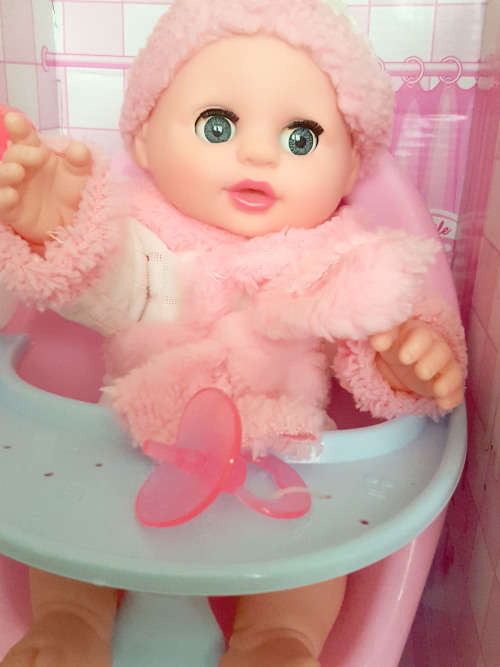 Absolutely beautiful baby doll with feeding chair.