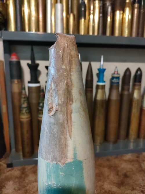 Shell 90mm case and impact damaged practice projectile