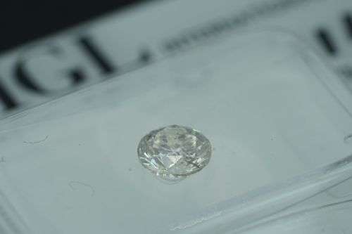 **IGL CERTIFIED R12716**0.51CT ENHANCED NATURAL WHITE 'G' ROUND CUT DIAMOND Si2+-