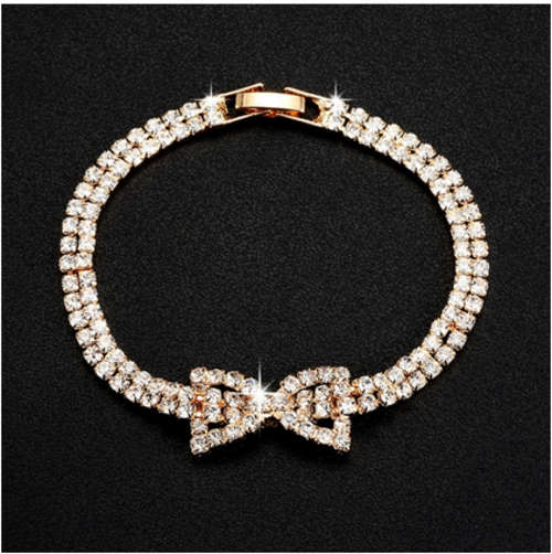HEADTURNER!! YELLOW GOLD PLATED SIMULATED DIAMOND BOW BRACELET