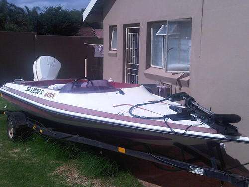 PHOENIX SUPERCRAFT 5M BOAT WITH JOHNSON V4 115 2STROKE MOTOR ON TRAILER