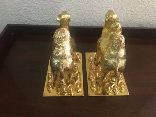 A Pair of Golden `World of Feng Shui` Camels