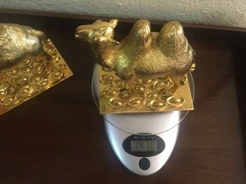 A Pair of Golden `World of Feng Shui` Camels