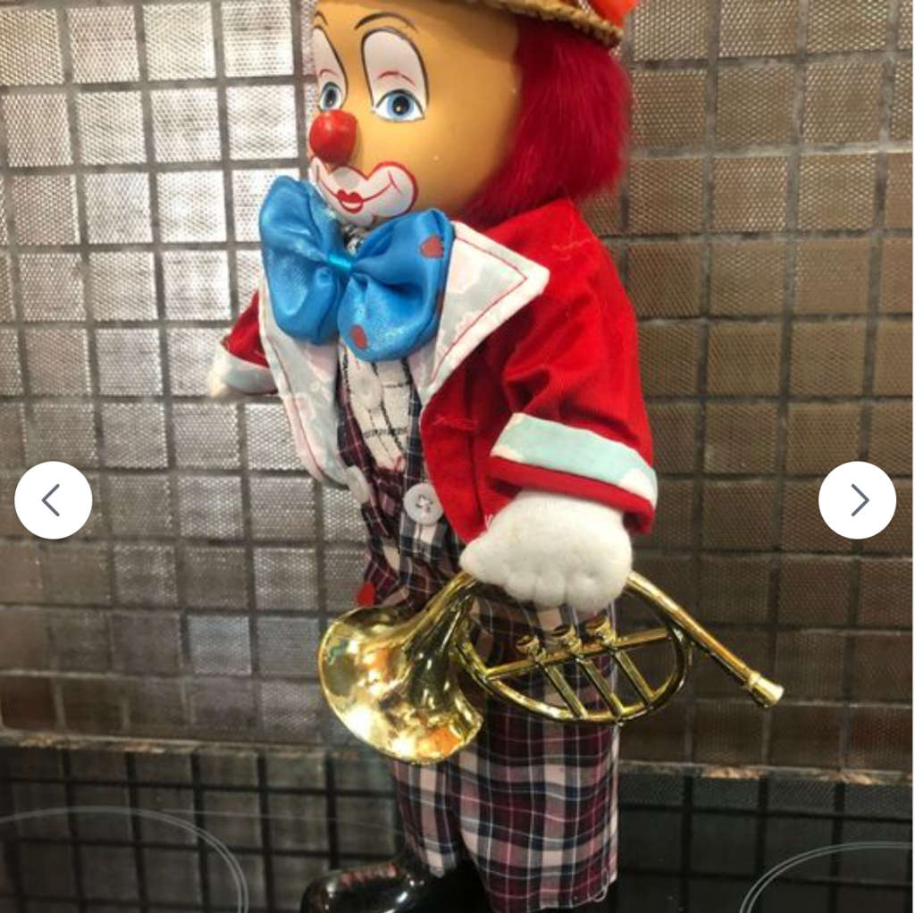 Stunning Porcelain Clown with Grass Hat