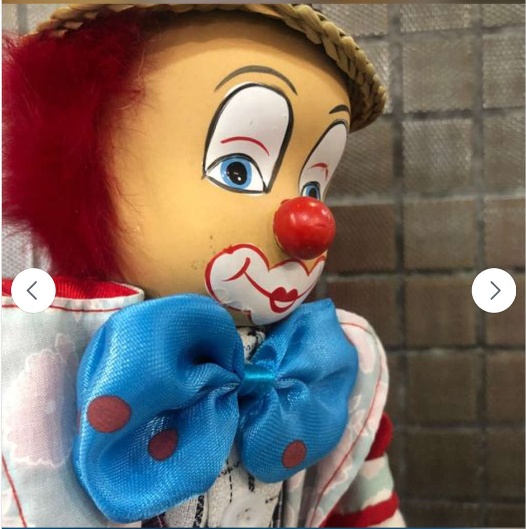 Stunning Porcelain Clown with Grass Hat