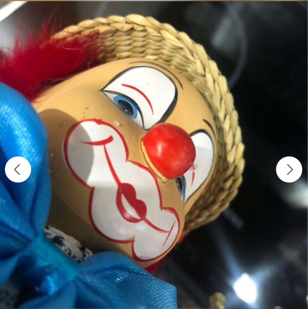 Stunning Porcelain Clown with Grass Hat