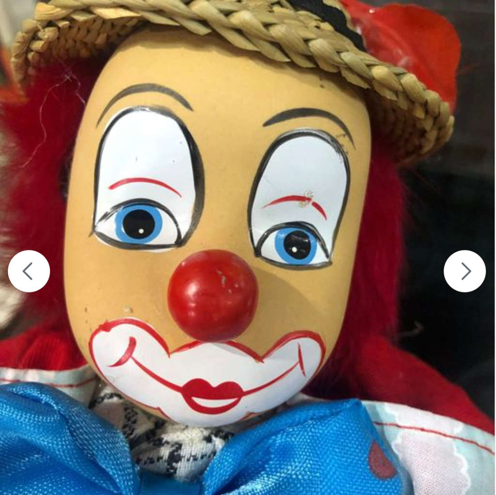 Stunning Porcelain Clown with Grass Hat