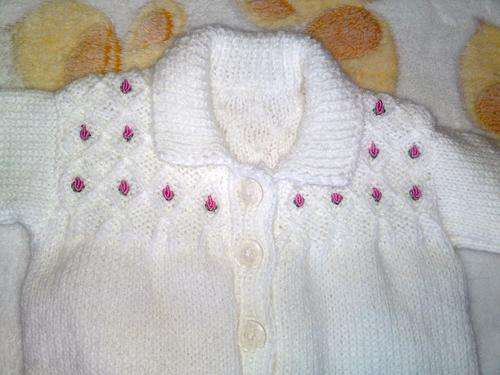 White babygrow with embroidered roses