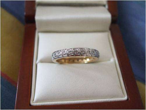 SOLID 9CT GOLD WITH 25X0.15 DIAMONDS ETERNITY RING.  EXCELLENT SETTING