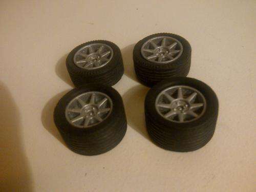 4 x 1/32 SCALE SLOT CAR RIMS WITH NEW TYRES
