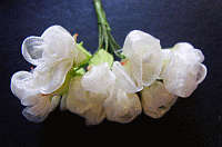 Cream Material Flowers, per bunch.