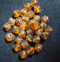 Amber Indian Bicones, Medium (+/- 6mm) - Pack of 50.