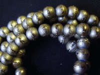 Olive Miracle Lined, 8mm - Per String ( +/-100 beads).