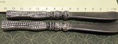 Two butter knifes