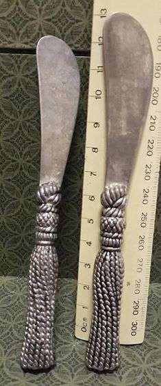 Two butter knifes