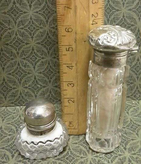Two small crystal silver topped perfume bottles