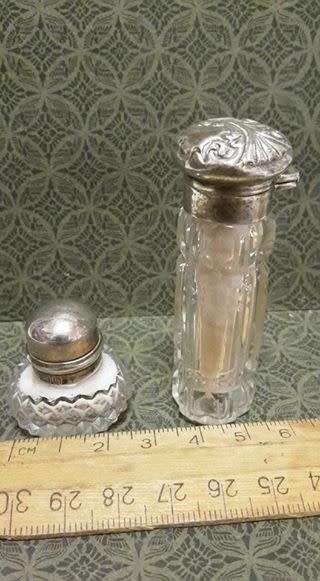 Two small crystal silver topped perfume bottles