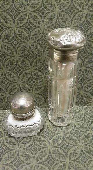 Two small crystal silver topped perfume bottles