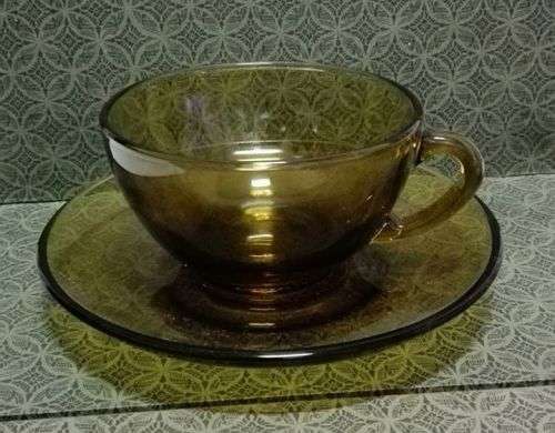 Amber glass cup and saucer