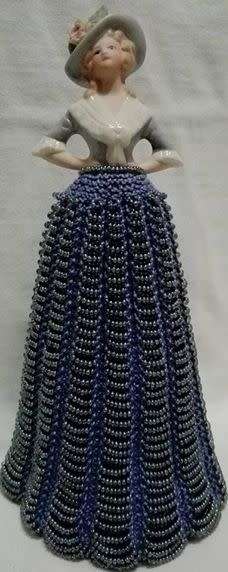 Porcelain half doll with beaded dress. Beautiful!!