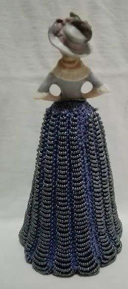 Porcelain half doll with beaded dress. Beautiful!!