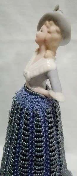 Porcelain half doll with beaded dress. Beautiful!!