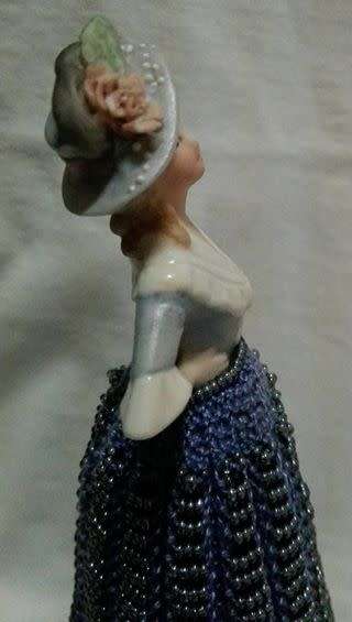 Porcelain half doll with beaded dress. Beautiful!!