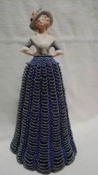 Porcelain half doll with beaded dress. Beautiful!!