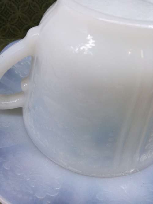 Stunning pressed milk glass cup and saucer!