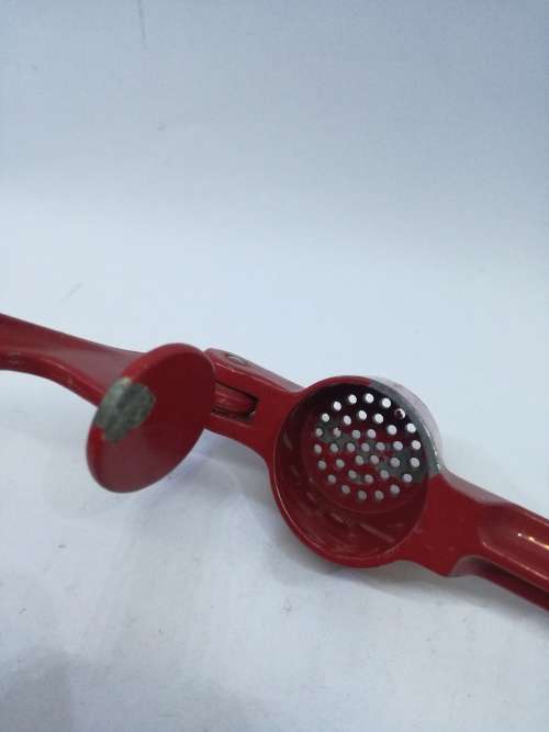 Vintage  garlic crusher - Red