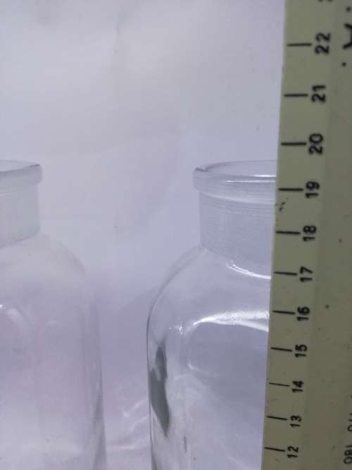 2 Vintage bottles with glass stoppers