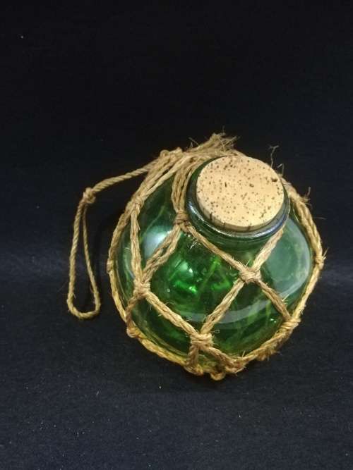 Gorgeous green round glass corked bottle