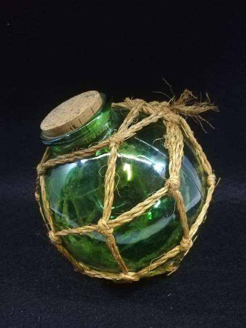 Gorgeous green round glass corked bottle