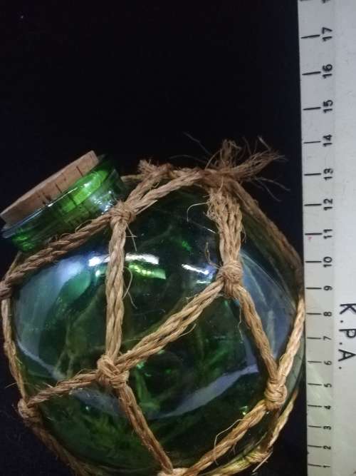 Gorgeous green round glass corked bottle
