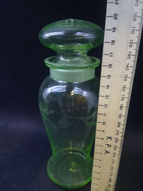 Uranium glass container - the lid has damage but you cant see it when displayed