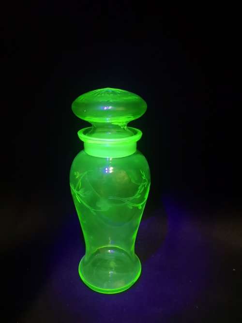 Uranium glass container - the lid has damage but you cant see it when displayed