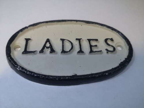 Cast iron ladies/gents signs