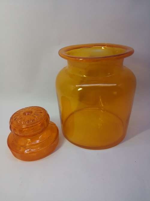 Bright orange glass bottle and glass lid