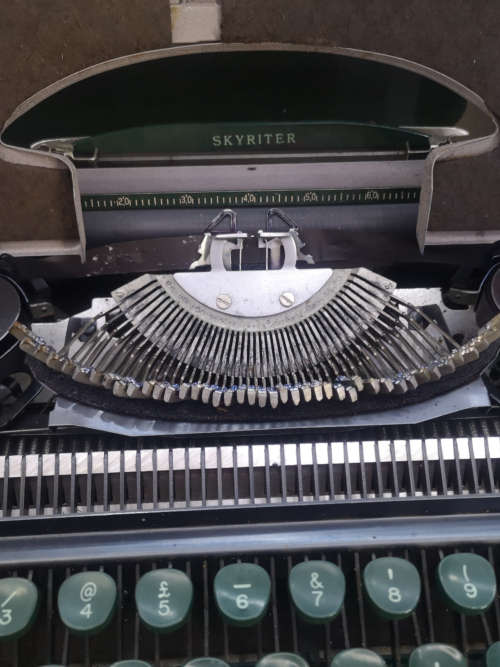 Smith Corona Skyriter Portable Typewriter with metal carry case