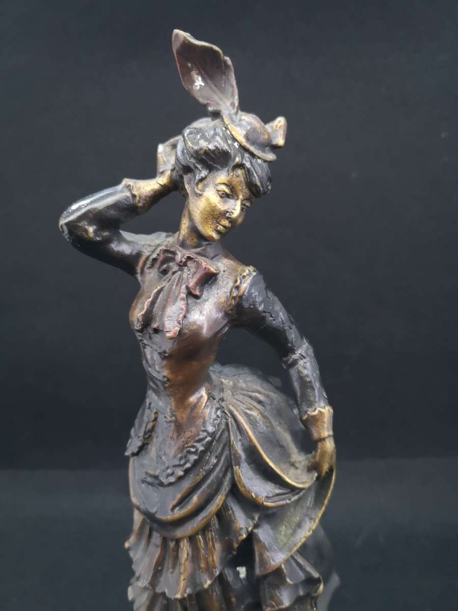 Heavy cast metal woman with sausage dog