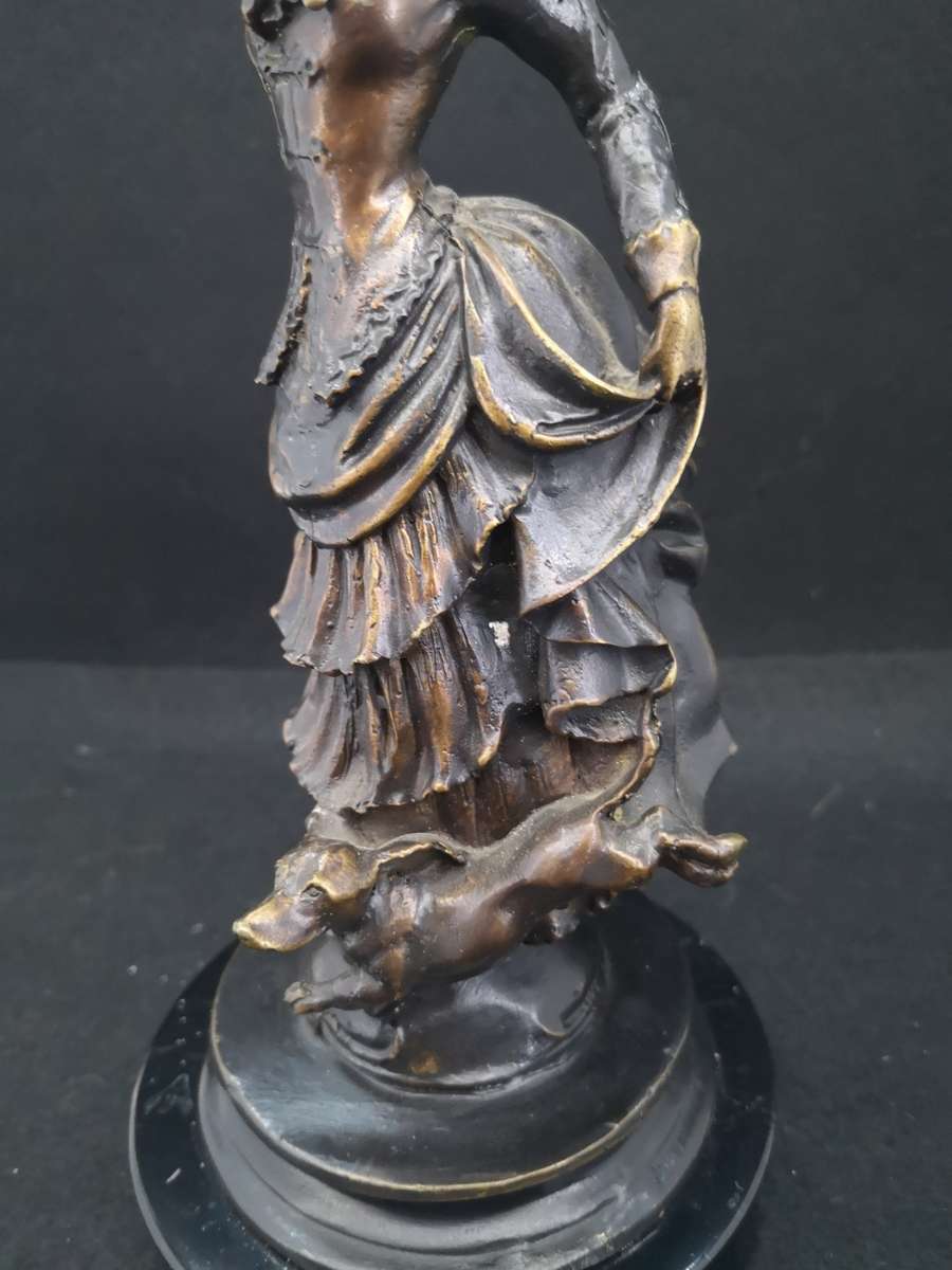 Heavy cast metal woman with sausage dog