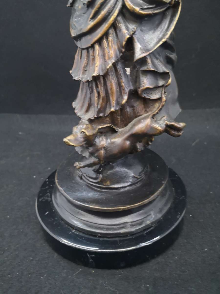 Heavy cast metal woman with sausage dog