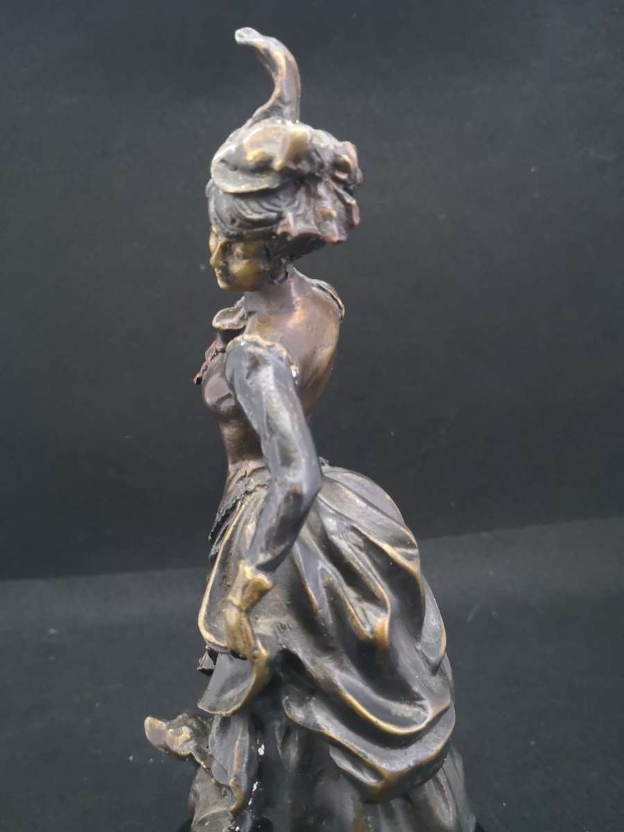 Heavy cast metal woman with sausage dog
