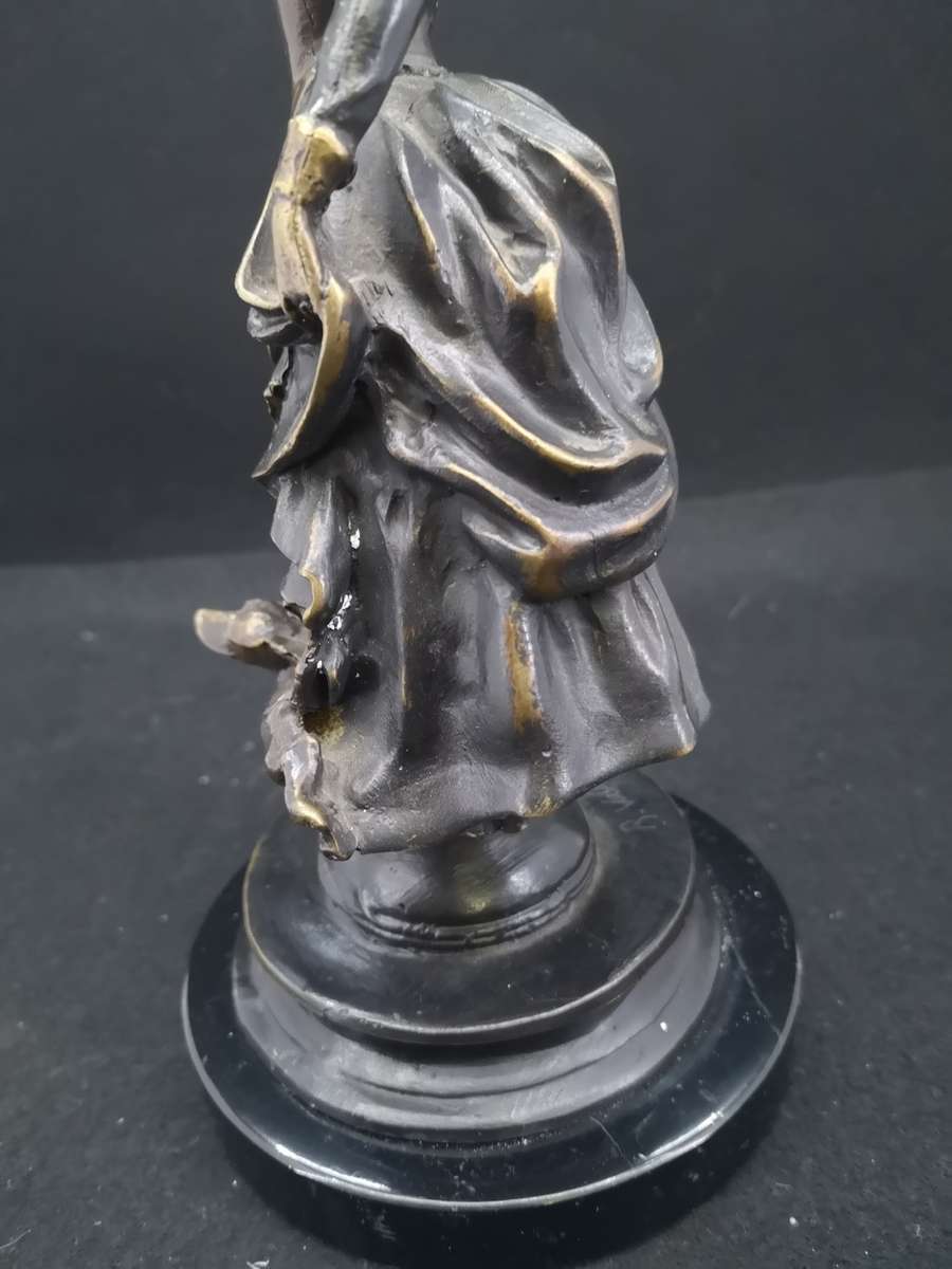 Heavy cast metal woman with sausage dog