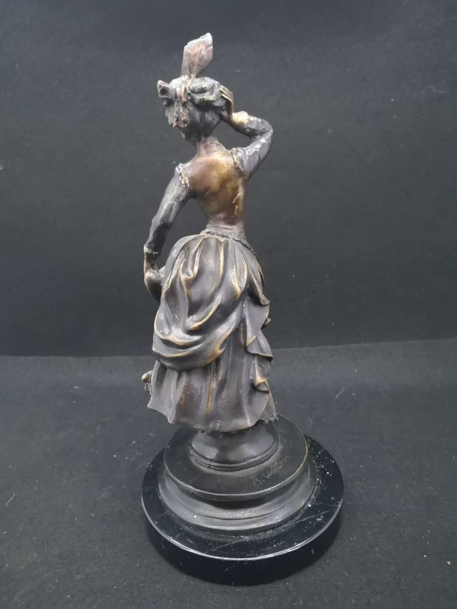 Heavy cast metal woman with sausage dog