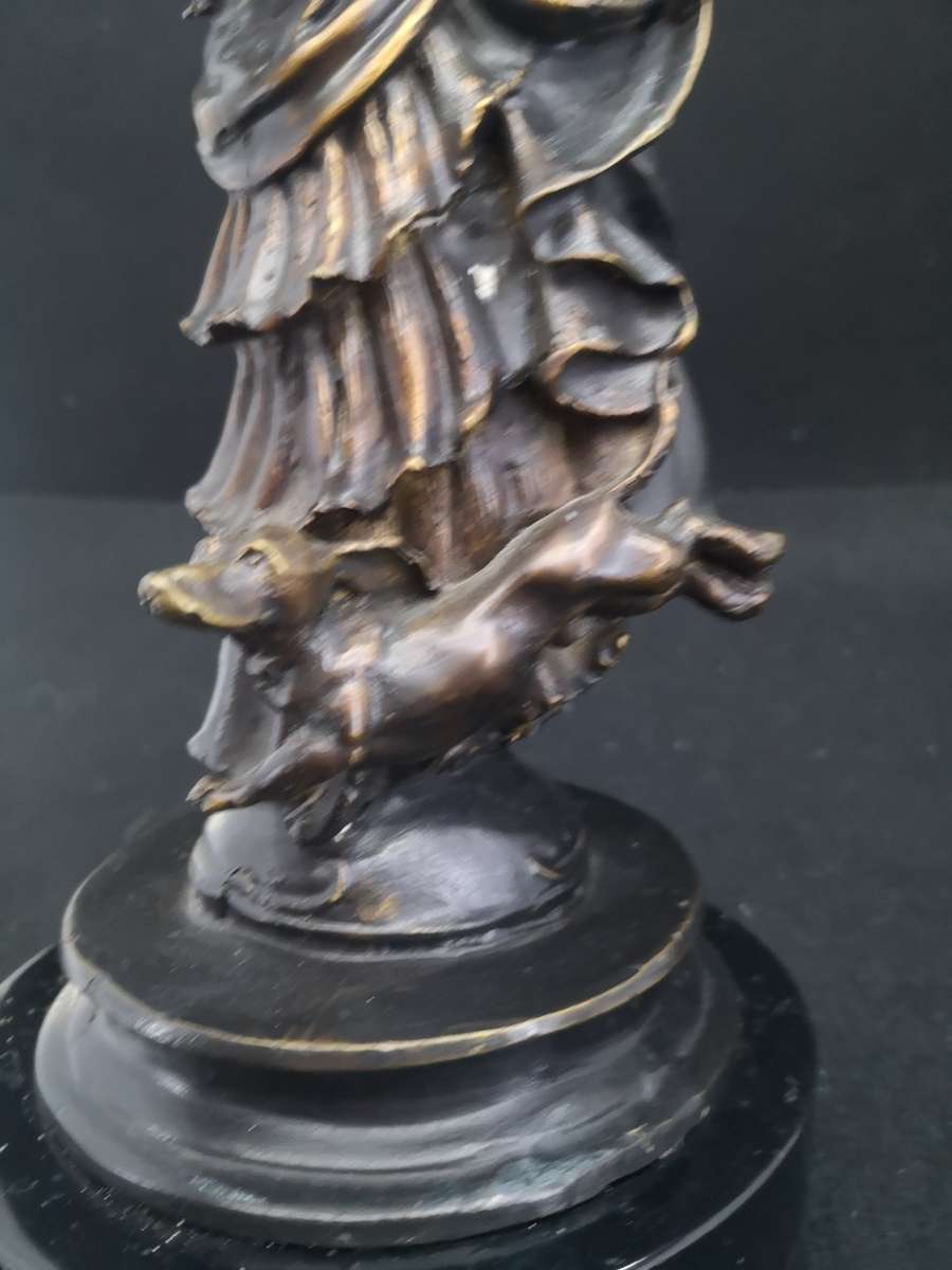 Heavy cast metal woman with sausage dog